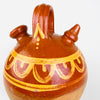 Northern Spanish botijo in red terracotta with partial brown glaze and hand painted yellow banding, made as a traditional water jug for cooling and storing water. The broad shoulder, tall loop handle, open mouth, and tapered spout define the classic functional form, while the unglazed lower section preserves the porous clay character associated with antique Spanish pottery. This decorative vessel suits rustic decor, wabi sabi decor, and country home pottery displays.