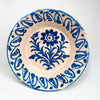 Antique Spanish Fajalauza lebrillo bowl from Granada, dating to the 19th century, made in tin glazed terracotta with a warm cream-white ground and bold cobalt blue decoration. The center shows a hand painted floral spray, while the wide inner wall carries a repeating blue border. This Granada pottery bowl works as a decorative bowl, table centerpiece, or wall hanging ceramic for Mediterranean decor, rustic home decor, and vintage home decor.