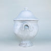Large vintage French soup tureen with lid, made from substantial white glazed earthenware and raised on a flared pedestal base. Its rounded body, paired side handles, and domed cover create a sculptural decorative bowl for a dining room sideboard, kitchen island, or collected French country decor display.