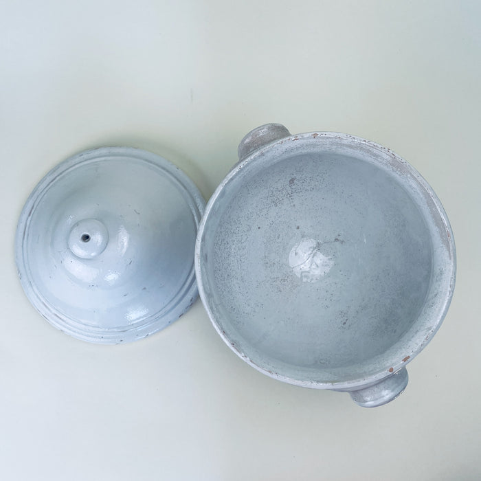 Vintage French soup tureen presented as a large decorative bowl, with white glazed ceramic construction, a fitted cover, twin handles, and a raised pedestal base. Measuring 35 cm tall, the piece has the scale of a statement vessel for farmhouse decor, French provincial decor, or a collected kitchen display.