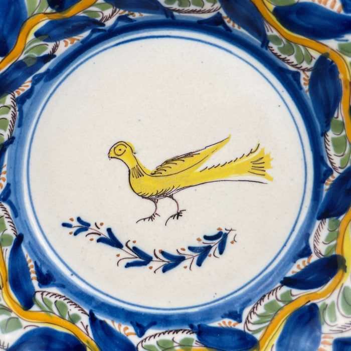 Angled shot of outer rim highlighting color layering and glaze flow across relief texture, perfect for collectors of Mediterranean or Spanish Majolica-inspired ceramics.