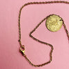 Artisan Mediterranean necklace featuring hammered coin discs, gold-tone alloy chain, and spring-ring clasp. A layering necklace designed for contemporary fashion styling, minimalist wardrobes, and summer resort collections.