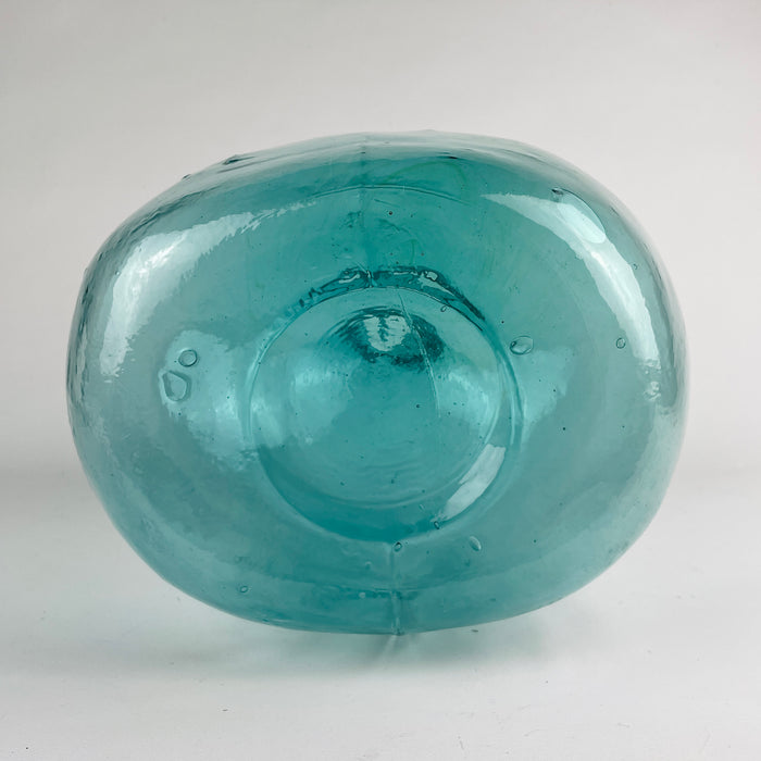 Vintage Spanish glass demijohn with embossed Viresa mark and a generous balloon form, presented as a hand blown blue bottle that works equally as storage history and decorative object. The cool blue green color pairs naturally with olive branches and dried stems, making it suitable for Mediterranean decor, vintage home decor, and rustic interiors.