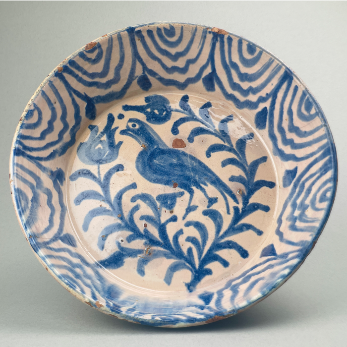 Large vintage Spanish basin in traditional Andalusian Fajalauza style, showcasing blue hand-painted patterns over cream background with natural glaze imperfections
