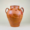 Large Spanish terracotta floor vase with two raised loop handles, warm ochre and reddish brown glaze runs, visible throwing lines, and a substantial 8.2 kg weight. The antique pottery vessel measures 43 cm high and suits entryway decor, fireplace styling, dried branch display, Mediterranean decor, and rustic farmhouse decor.