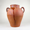 Antique XL decorative terracotta vase from Spain, made as a large two handle pottery vessel with red-orange earthenware clay, amber glaze drips, rounded body, wide neck, and visible age-related patina. This Spanish pottery floor vase works as Mediterranean decor, rustic home decor, farmhouse decor, and a sculptural floor vessel.