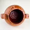 Antique terracotta floor vase in red-orange Spanish earthenware, featuring a rounded storage jar shape, wide neck, raised loop handles, and glossy glaze trails descending from the rim and shoulder. The vessel adds texture to Mediterranean decor, rustic home decor, wabi sabi decor, and organic modern rooms.