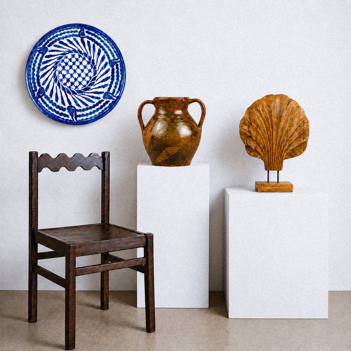 Large Fajalauza lebrillo bowl displaying its complete spiral composition of cobalt blue leaves, wavy border bands and central floral lattice over a creamy white glaze. The broad round form and original hanging holes create a versatile piece of Granada pottery for fruit or salad service, ceramic wall art, farmhouse decor or Mediterranean home decor.