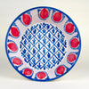 Large Spanish Fajalauza lebrillo bowl made in Granada, Spain, hand painted in red and blue over a cream-white glazed terracotta body. The deep rounded form, red pomegranate border, blue rim, and geometric central lattice make it suitable as a table centerpiece, fruit bowl, or Mediterranean decor wall display.