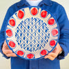 Red pomegranate Fajalauza bowl created as a contemporary Granada pottery piece with original ROC Objects design. The hand painted blue pattern, deep lebrillo shape, and white glazed interior connect the bowl to Andalusian ceramic heritage while fitting Mediterranean decor, cottage decor, and warm eclectic interiors.