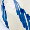 Blue and white Spanish pottery bowl with a deep footed form and an all-over hand painted interior, produced by Cerámica Los Arrayanes in Granada. Cobalt brushstrokes form a central flowered grid surrounded by rotating botanical motifs, giving this substantial lebrillo visual movement and a strong decorative presence on a table or wall.