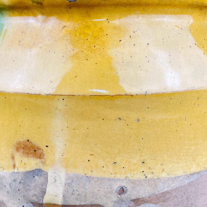 Detailed view of glaze running vertically across body surface, with visible brushwork and drip marks. The high-contrast color and matte base texture enhance its sculptural appeal for contemporary rustic or global eclectic interiors.