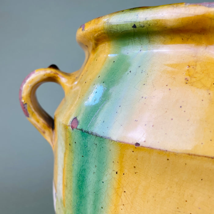 Close-up of one handle showing patina, glaze streaking, and craquelure, emphasizing its artisanal craftsmanship and wear. Perfect for rustic kitchens, antique ceramic collections, or wabi-sabi inspired interior environments seeking organic charm.