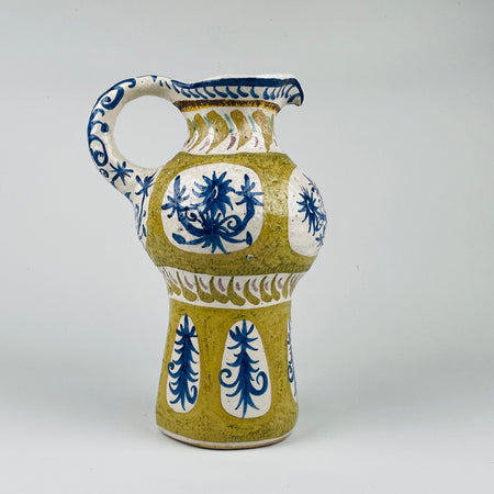 Antique French Quimper vase crafted in terracotta with cobalt blue and ochre glaze, showing the sculptural silhouette typical of mid century modern Breton modernism. This rare ceramic jug blends folk motifs and avantgarde modernism, perfect for rustic home decor or organic modern decor collections.