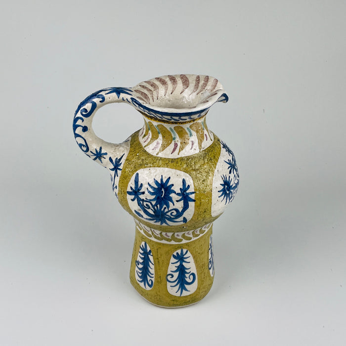 Overhead view of the flared rim on the Antique French Quimper vase, showing ochre glaze, cobalt brushwork, and asymmetrical shaping inspired by mid century modern ceramics and Picasso’s Vallauris studio work.