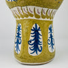 Detail of Antique French Quimper pottery with painted foliate motifs and glazed texture. The design bridges traditional Breton folk art and mid century modern abstraction, making it a rare collectible piece for organic modern decor settings.