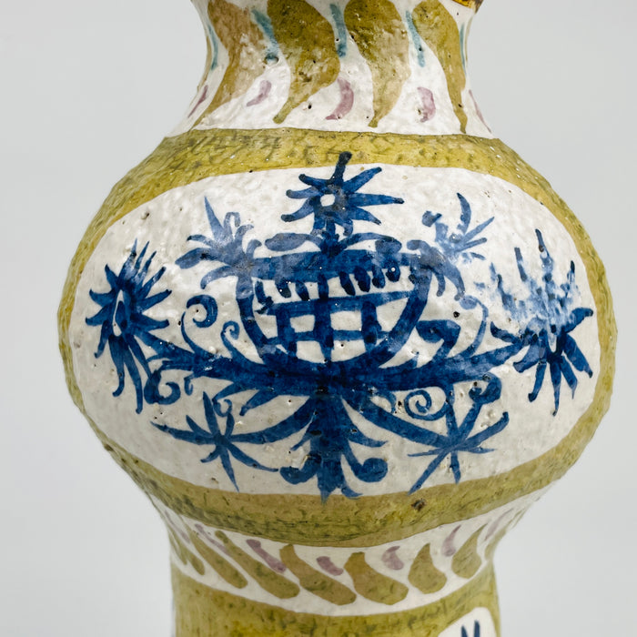 Close-up of the Antique French Quimper faience vase, focusing on hand-painted geometric motifs inspired by Breton modernism. The form reflects mid century modern design with a strong sculptural presence suited for organic modern decor and rare French pottery collectors.
