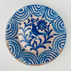 Vintage Spanish Fajalauza bowl from Granada, Andalusia, made in tin glazed earthenware and hand painted in cobalt blue. The interior shows a stylized bird among scrolling leaves with a sunflower style rosette above, framed by a wavy band rim border. Works as a decorative bowl, fruit bowl, or serving bowl for Mediterranean decor and coastal decor kitchens.