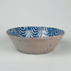 Spanish Fajalauza ceramic bowl, hand painted in cobalt blue on tin glazed earthenware, attributed to Granada, Andalusia. Interior decoration features a bird, scrolling leaves, and a rosette flower, with an all around wavy border that reads as classic folk pottery brushwork. Use as salad bowl or tabletop centerpiece in farmhouse decor dining settings.