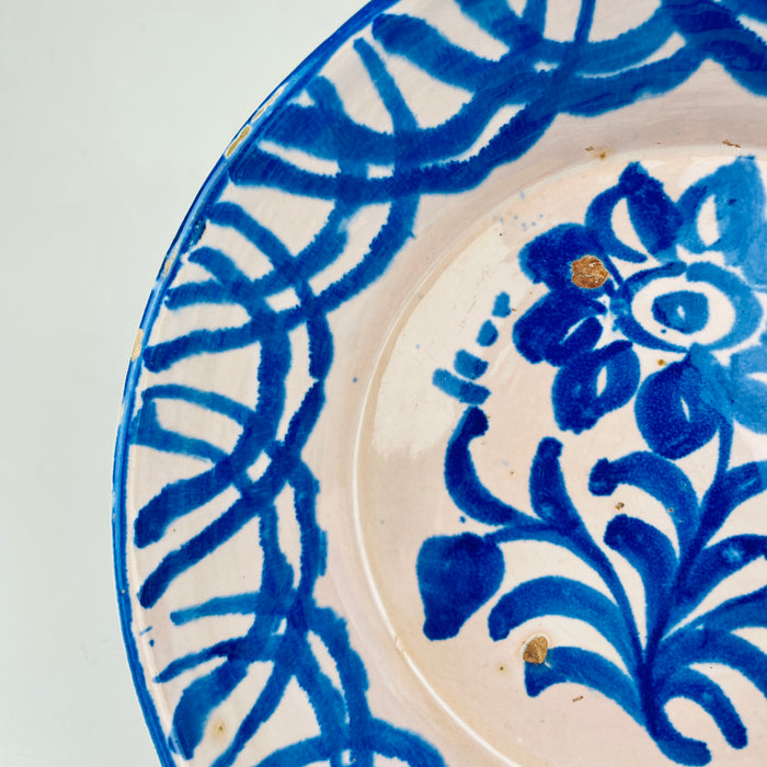 Hand painted Fajalauza bowl from Granada featuring cobalt floral decoration and geometric border patterns typical of 19th century Spanish tin-glazed ceramics, displaying natural irregularities and suitable for farmhouse decor, Cottage Decor, Rustic Home Decor, Mediterranean wall styling, wabi sabi, Japandi and Coastal decor inspiration.