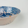 Spanish Fajalauza bowl from Granada in tin glazed ceramic with cobalt blue bird motif and floral scroll decoration. The rim interior features repeating wave bands and drip shapes that form a continuous border. Sized for tabletop serving, fruit display, or tapas presentation, pairing well with Mediterranean decor, coastal decor, and vintage home decor kitchen shelving.