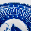 Blue and white Valencia ceramics bowl in the Manises tradition, tin glazed earthenware with hand painted cobalt decoration. The central bird motif and leafy scroll sit inside a dotted ring, while the rim carries a Greek key meander and bold cobalt banding, suited for farmhouse decor, vintage kitchen styling, and coastal decor accents.