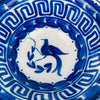 Antique Spanish Manises bowl, cobalt blue bird and botanical motif on white tin glaze, with a Greek key border that frames the interior patterning. The deep bowl form works as a decorative bowl, fruit bowl, or serving bowl for dry foods, and complements Mediterranean decor, wabi sabi decor, and French country decor without changing its Spanish ceramic identity.