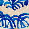 Hand painted Spanish lebrillo from Granada with geometric rim and floral centre, tin glazed earthenware, 29cm wide, perfect as wall decor for Rustic Home Decor, Cottage Decor, Japandi style displays, wabi sabi pottery collections, Mediterranean Decor, Coastal decor, Vintage Kitchen styling or French country decor homes.