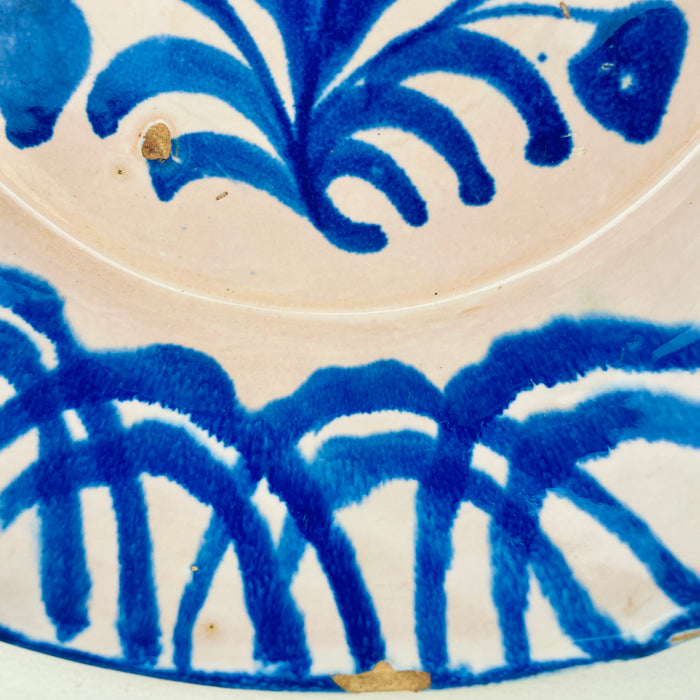 Hand painted Spanish lebrillo from Granada with geometric rim and floral centre, tin glazed earthenware, 29cm wide, perfect as wall decor for Rustic Home Decor, Cottage Decor, Japandi style displays, wabi sabi pottery collections, Mediterranean Decor, Coastal decor, Vintage Kitchen styling or French country decor homes.