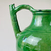 Close-up of the green glaze texture on the gargolette neck and shoulder, showing crackle and brush marks
Detail of the antique French gargolette’s emerald green glaze reveals surface irregularities, brush strokes, and crackling, emphasizing the handcrafted nature of this rustic 19th-century pottery water jug used in traditional rural households.