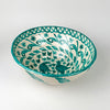 Hand painted Spanish pottery bowl with green bird decoration, made as a Fajalauza lebrillo in glazed terracotta. The interior includes twin birds, flowers, leaves, spiral vine motifs, and a border pattern, while the exterior shows broad green brushstrokes, making it suitable for wall display, serving decor, or ceramic wall art.