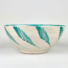 Farmhouse decor accent made from Spanish glazed terracotta, with a hand painted Fajalauza green bird design inside a large lebrillo bowl. The cream ground, turquoise green rim, loose brushwork, floral motifs, and terracotta body create a decorative ceramic bowl for wall display, serving display, or vintage home decor.