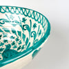 Green hand painted Fajalauza bowl with twin bird decoration, foliate scrolls, floral patterning, and a bold turquoise green border. This Spanish lebrillo bowl is made from glazed terracotta and can be used as ceramic wall art, a decorative serving bowl, or a statement pottery piece for farmhouse decor and rustic home decor.