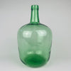 Vintage Spanish green glass demijohn vase made by VIRESA in Benigànim, Valencia, circa 1960s, held at torso height to show its medium 32 cm scale. The 5 L wine carboy has a broad rounded body, narrow neck, reinforced rim, luminous sea green color and natural bubbles, making it a distinctive vessel for Mediterranean decor.