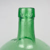 vintage VIRESA green glass demijohn made in Benigànim, Valencia, circa 1960s, showing the vertical mould seam along the tapered neck and the reinforced bottle mouth. Natural bubbles and subtle glass waves remain visible around the 5 L mark, confirming the character of mid century Spanish utilitarian glass rather than modern decorative glassware.