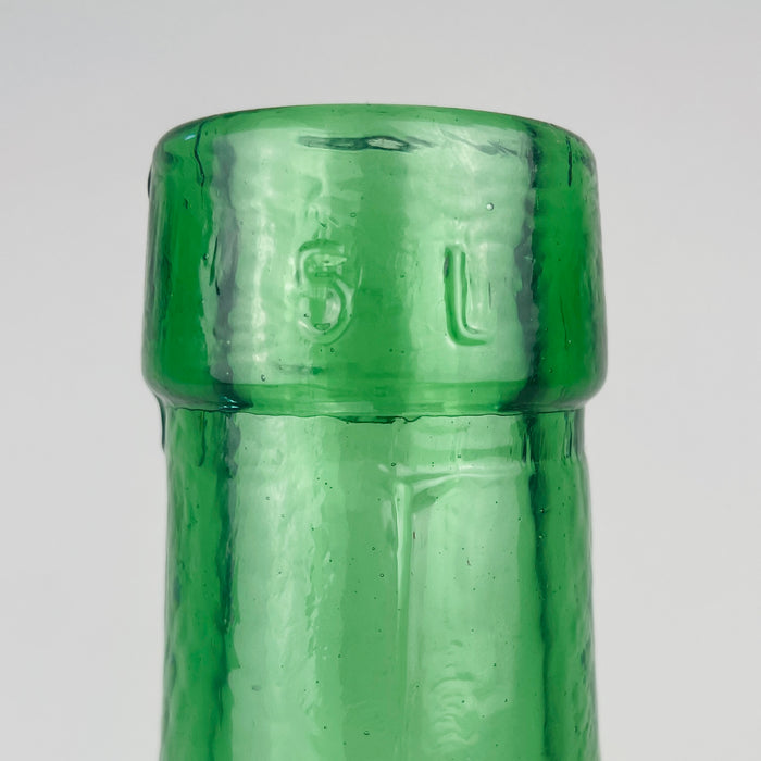 Vintage green glass demijohn vase by VIRESA of Valencia, Spain, circa 1960s, with the maker and 5 L capacity moulded around its reinforced neck. The pale sea green body deepens to emerald at the rim and base, emphasizing the thickness of the glass. Used empty or with foliage, this Spanish wine carboy brings color and history to eclectic decor.