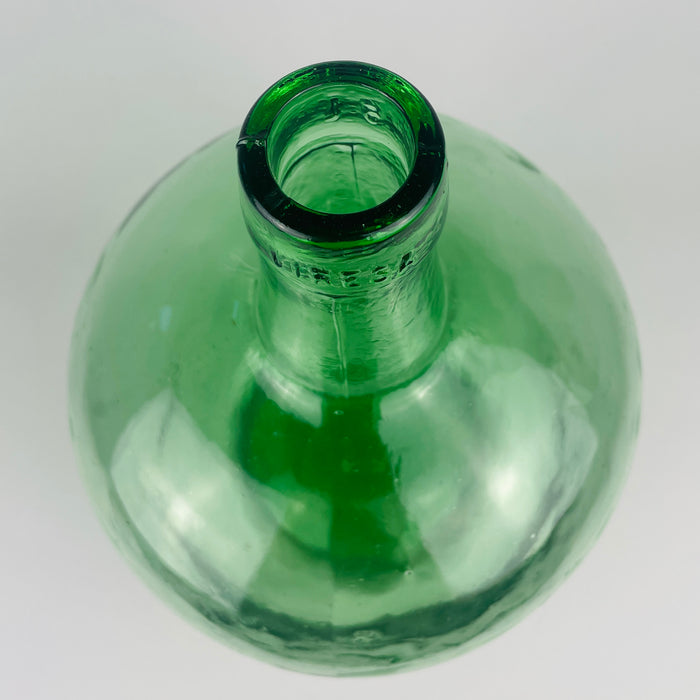 Vintage VIRESA demijohn vase in transparent green mould blown glass from Valencia, Spain, dating to circa 1960s. Its 5 L body has an oval cylindrical profile, curved shoulders, a tall tapered neck and a heavy rounded mouth, with ripples and small bubbles throughout the glass. The restrained form suits coastal decor and collected vintage home decor.