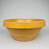 Close detail of the rim demonstrates glaze thickness, clay body texture, and the subtle asymmetry of hand thrown terracotta. The warm amber ochre glaze highlights the craftsmanship of late 19th century French pottery. Ideal for farmhouse decor, cottage kitchen decor, and Mediterranean homes.