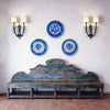 Decorative blue and white plates on a wall above an antique wooden bench. Wall decor with lebrillo bowls with cobalt blue floral sprig design and a wide blue rim band. Wall hangings pair well with Japandi decor, wabi sabi decor, farmhouse decor, and Mediterranean decor interiors.